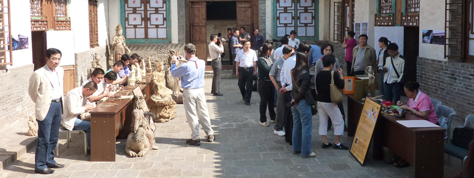 Become a Site Coordinator - Demonstration by local craftsmen during the grand opening of GHF restored courtyard in Pingyao, China.